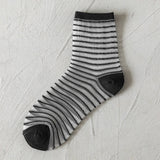 BLACK AND WHITE JACQUARD TRANSPARENT MID TUBE SOCKS_CWMS0414