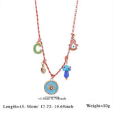 FABRIC SUN MOON NECKLACE WITH PINK CRYSTAL CHARM_CWMM7539