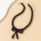 IMITATION PEARL BEADED NECKLACE WITH PEARL BOW_CWAJE1163