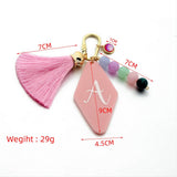 LETTER ACRYLIC KEYCHAIN WITH GEOMETRIC CHARM_CWMM7023