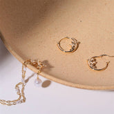 SWEET CUPID PEARL BOW COMPASS DANGLE EARRINGS_CWAJE5107