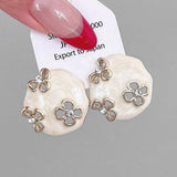 HOLLOW ZIRCON GEOMETRIC FLOWER EARRINGS_CWAJE2040