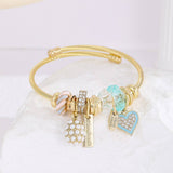 GOLD BRACELET WITH TREE HEART TAIL CHARMS_CWMM8620
