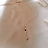 GEOMETRIC SEQUIN TASSEL NECKLACE_CWAJE2370