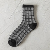 BLACK AND WHITE JACQUARD TRANSPARENT MID TUBE SOCKS_CWMS0414