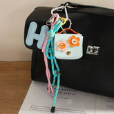 H LETTER FLORAL EARBUD POUCH KEYCHAIN_CWMM7733