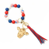 COW HEAD KEYCHAIN WITH TASSEL AND WOOD BEADS_CWAB5093