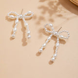 BOW FRENCH TASSEL PEARL EARRINGS_CWAJE1156