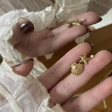 GOLD PLATED OCEAN STAR PEARL ASYMMETRIC EARRINGS_CWAJE5018