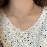 MICRO PAVED ZIRCONIA PEARL BOW PENDANT NECKLACE_CWAJE3059