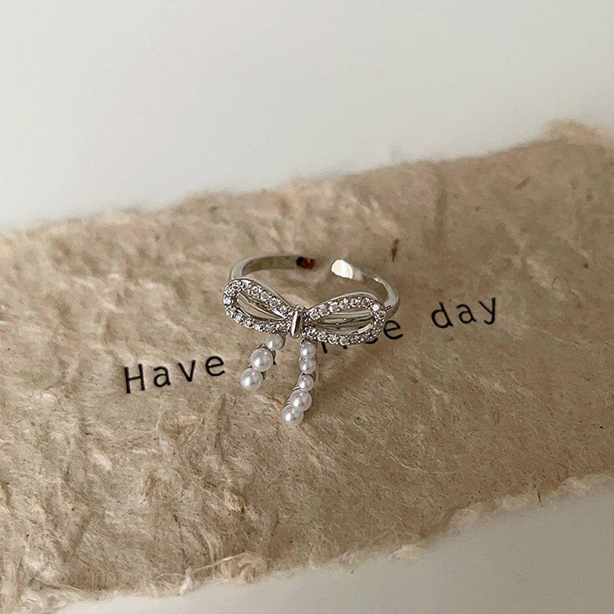 FASHIONABLE BOW SMALL PEARL RING FOR WOMEN_CWAJE3096