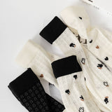 HOLLOW JACQUARD MIDDLE CALF SOCKS_CWMS0650