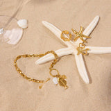 FISHBONE SHELL CHARM BRACELET 18K GOLD STEEL_CWAJE4752
