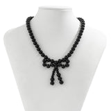 IMITATION PEARL BEADED NECKLACE WITH PEARL BOW_CWAJE1163