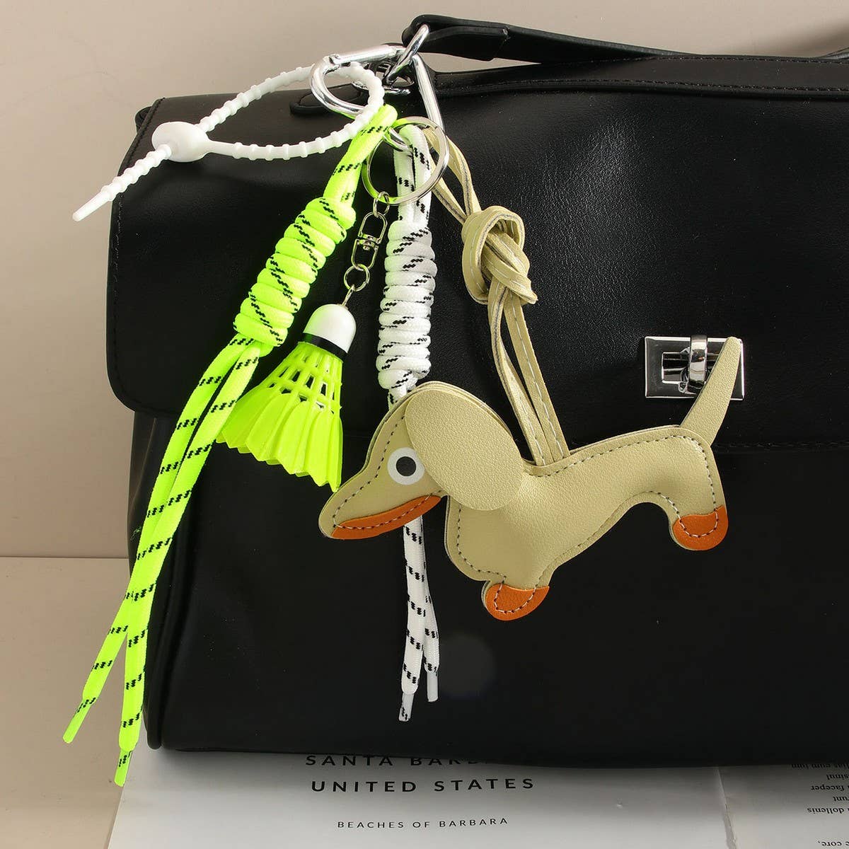 CUTE LEATHER DACHSHUND BAG CHARM WITH SHUTTLECOCK_CWMM7565