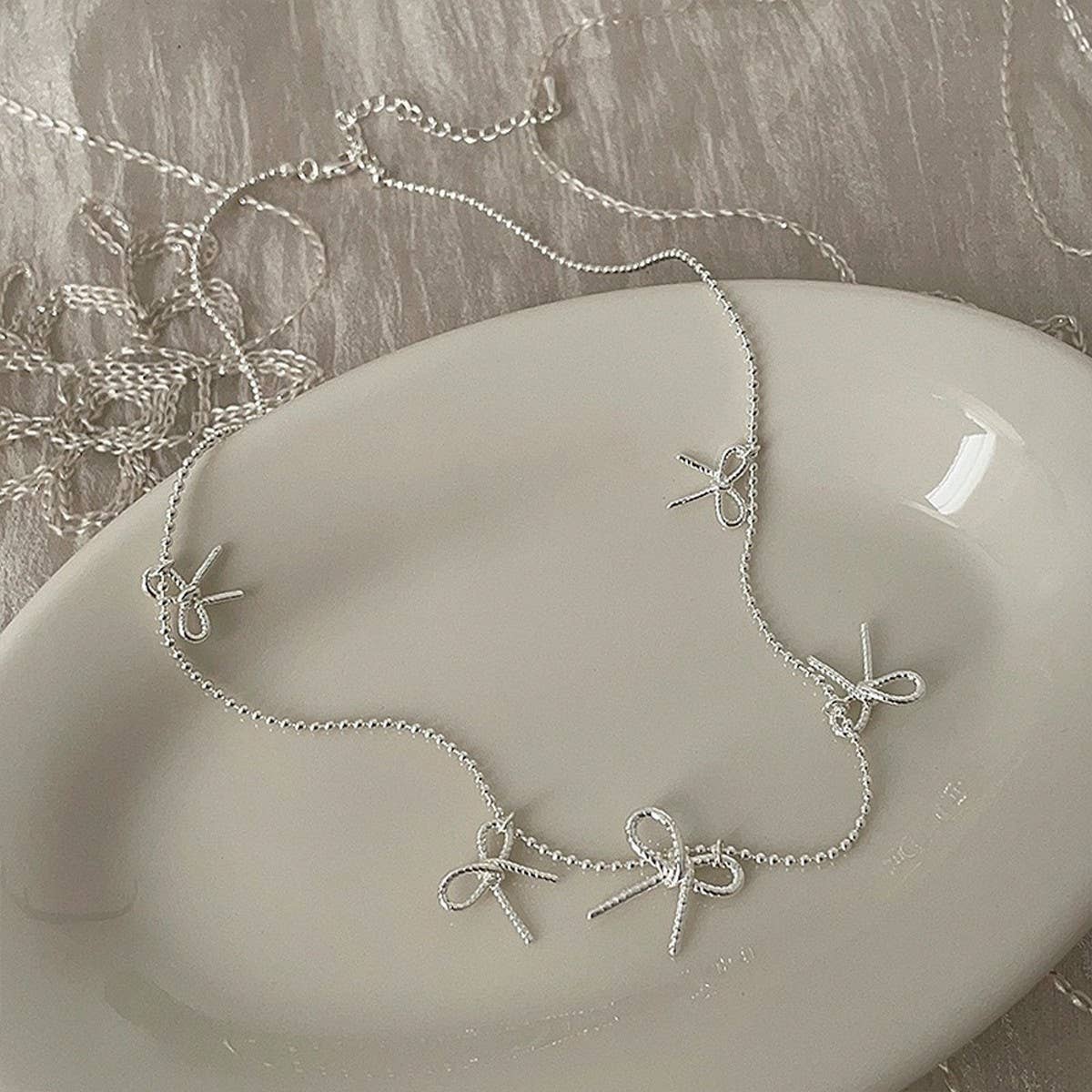 Womens Temperament Metal Bow Tassel Necklace