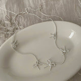 Womens Temperament Metal Bow Tassel Necklace