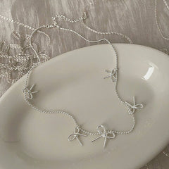 Womens Temperament Metal Bow Tassel Necklace