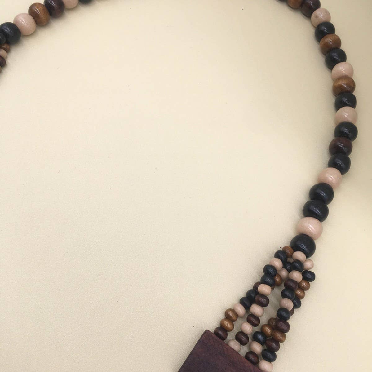 MULTI LAYERED GEOMETRIC WOODEN BEAD NECKLACE_CWMM4563