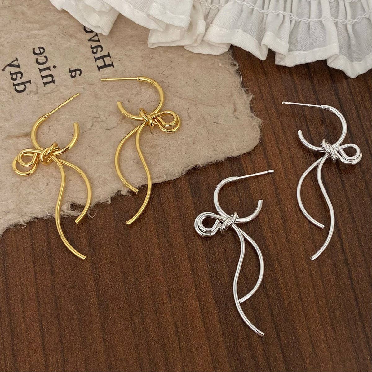 FASHIONABLE HIGH GRADE METAL BOW PENDANT EARRINGS_CWAJE2997