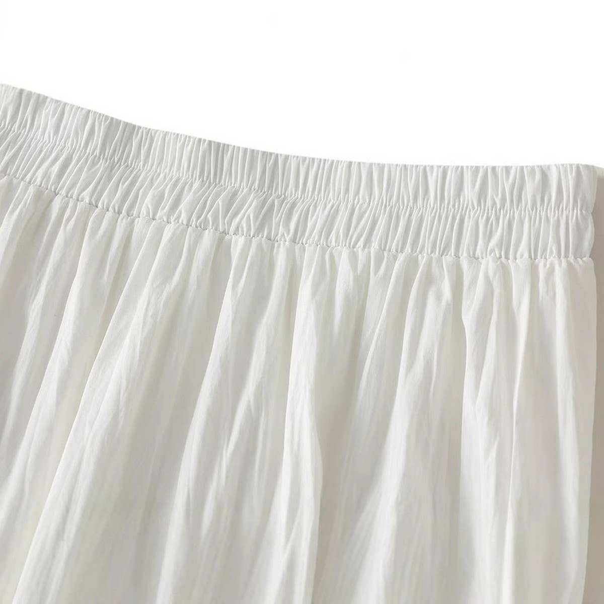 PANELED CAKE A LINE PLEATED SKIRT WITH FLOWING HEM_CWBMS0355