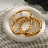 ELEGANT GOLD TONE ROUND BANGLE TITANIUM STEEL_CWAJE4704