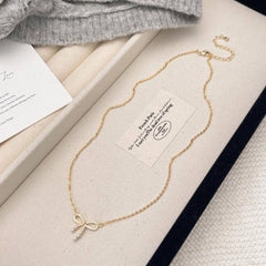 MICRO PAVED ZIRCONIA PEARL BOW PENDANT NECKLACE_CWAJE3059