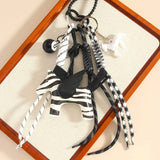 CUTE LEATHER PEGASUS CHARM WITH BRAIDED STRAP_CWMM7559