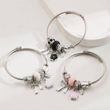 SILVER STEEL BRACELET WITH BOW FLOWER CHARMS_CWMM8613