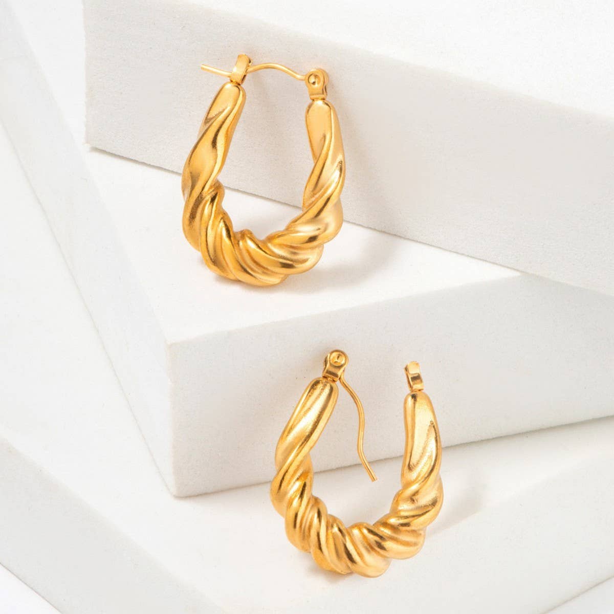 GOLD STAINLESS STEEL TWISTED U SHAPED EARRINGS_CWMM3652
