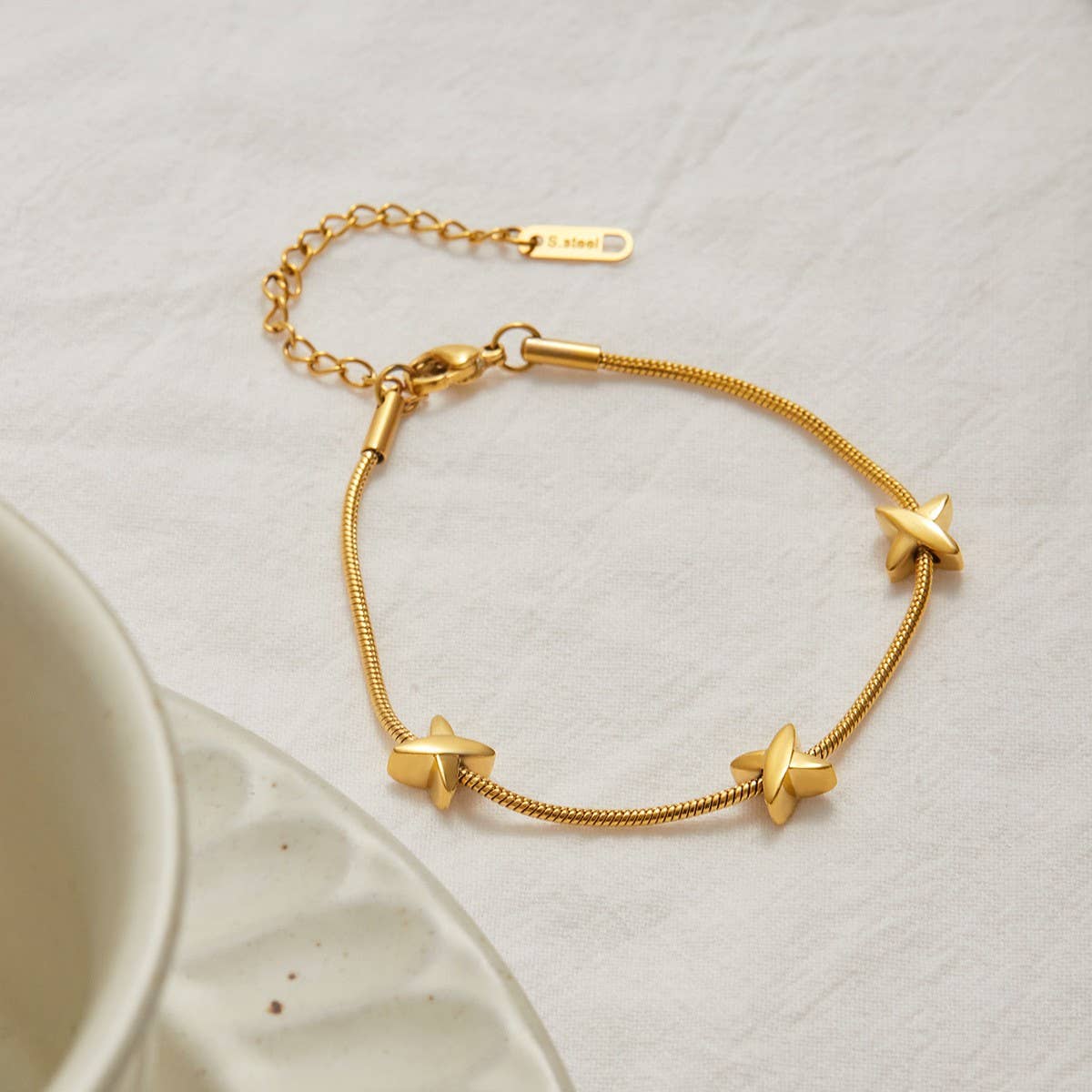 18K GOLD X CHARM BRACELET STAINLESS STEEL DESIGN_CWAJE4731