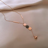 GEOMETRIC SEQUIN TASSEL NECKLACE_CWAJE2370