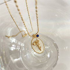 DECEMBER THREE DIMENSIONAL FLORAL OVAL NECKLACE_CWAJE1614