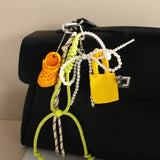 MINI HEADPHONE CASE KEYCHAIN BOW BAG CHARM_CWMM7871