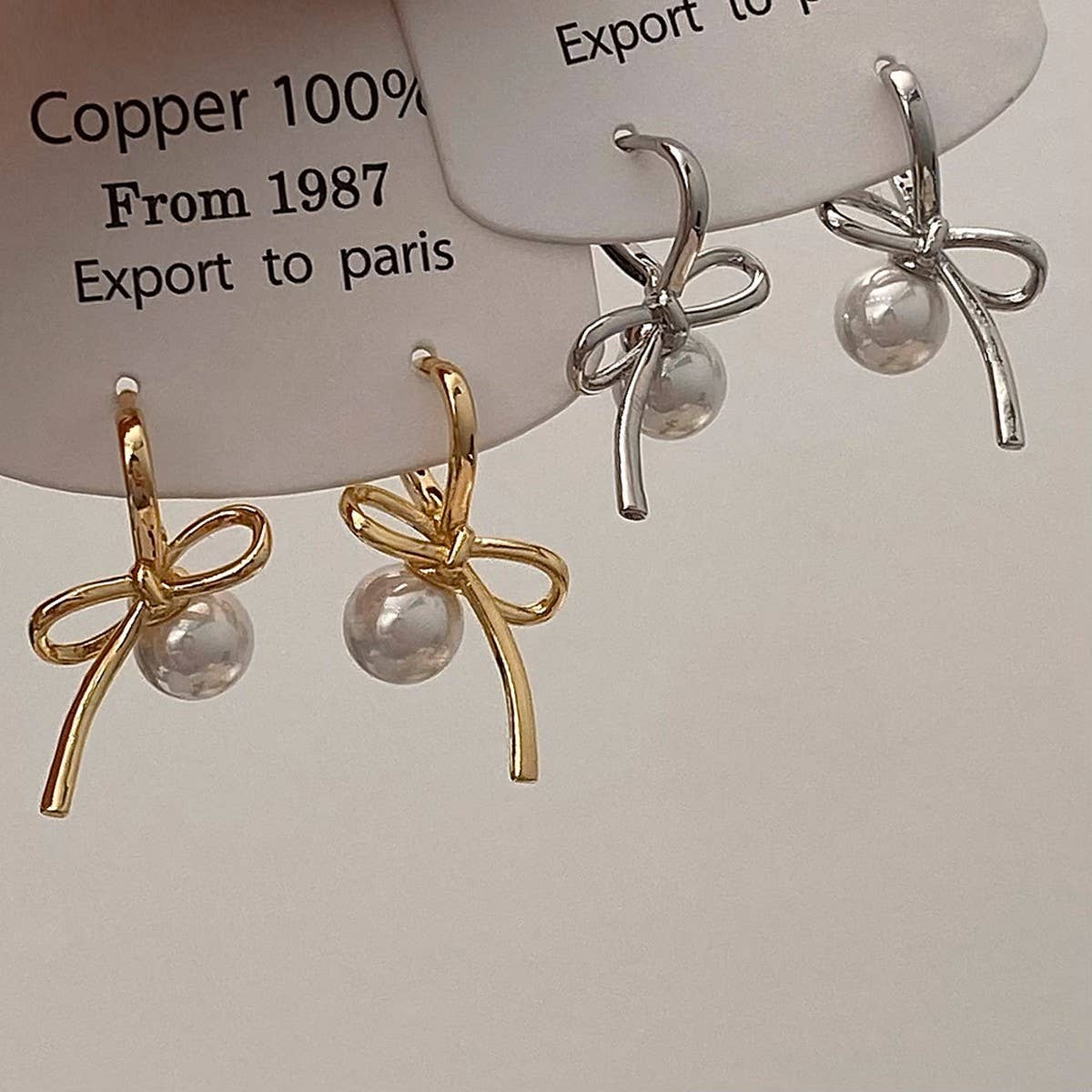 SIMPLE AND HIGH END PEARL PENDANT BOW EARRINGS_CWAJE2975