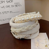 RETRO LOVE TWIST PEARL HEADBAND_CWAHA0829