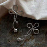 GEOMETRIC TWISTED FLOWER PEARL TASSEL BOW EARRINGS_CWAJE3005