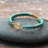 GOLD TONE REIKI SYMBOL YOGA BRAIDED BRACELET_CWAJE3922
