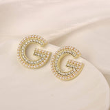 NEW SIMPLE HOLLOW FLOWER ENAMEL EARRINGS_CWAJE3991