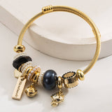 GOLD STAINLESS STEEL BRACELET WITH ANIMAL CHARMS_CWMM8574