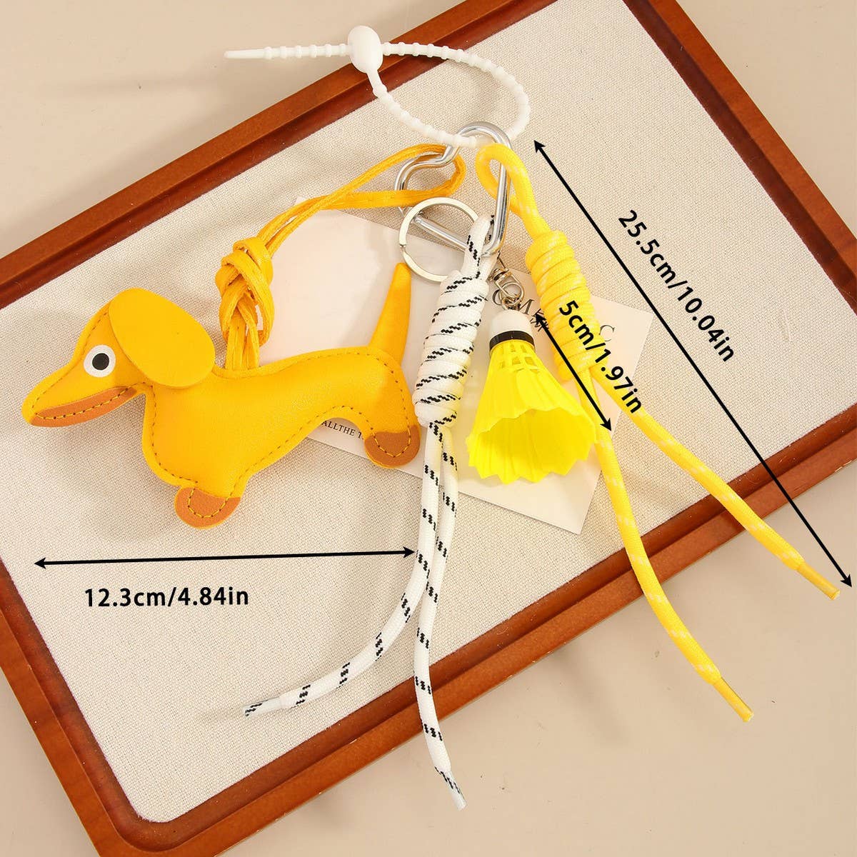 CUTE LEATHER DACHSHUND BAG CHARM WITH SHUTTLECOCK_CWMM7565