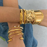 GOLD STAINLESS STEEL PEARL OPEN CUFF BRACELET_CWAJE4618