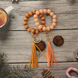 LEOPARD WOOD BEAD BRACELET WITH TASSEL KEYCHAIN_CWAB5107