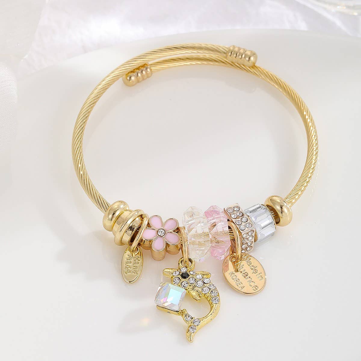GOLD STAINLESS STEEL DOLPHIN TAIL BRACELET_CWMM8490