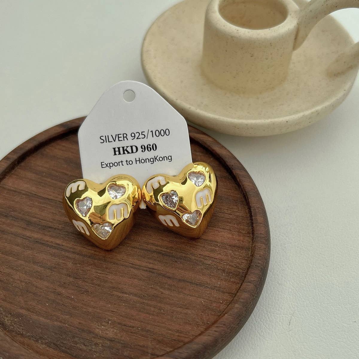 HALF FACE THREE DIMENSIONAL EARRINGS_CWAJE1345