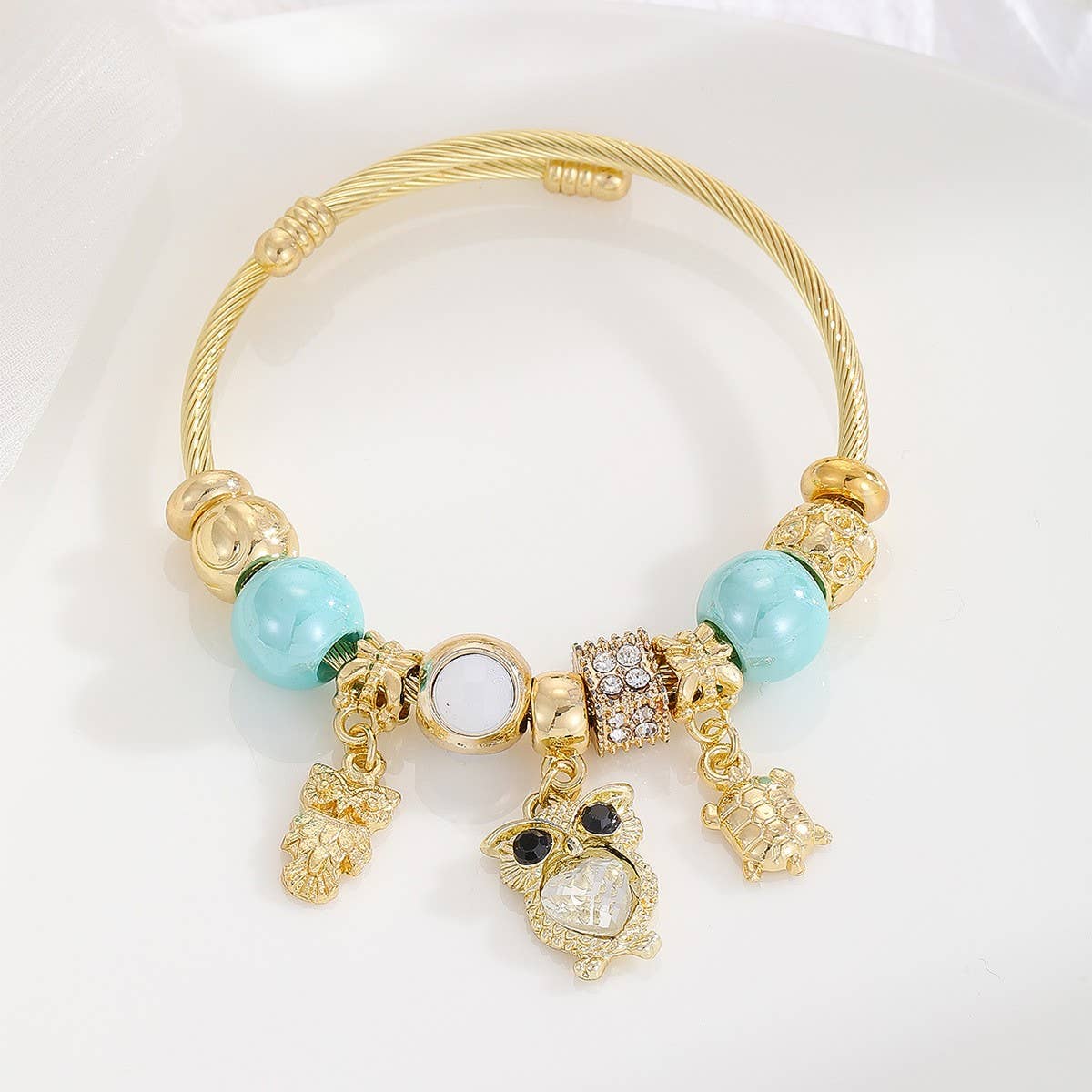 GOLD STAINLESS STEEL DOLPHIN TAIL BRACELET_CWMM8490