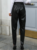 Black high-waisted lantern pants with bow