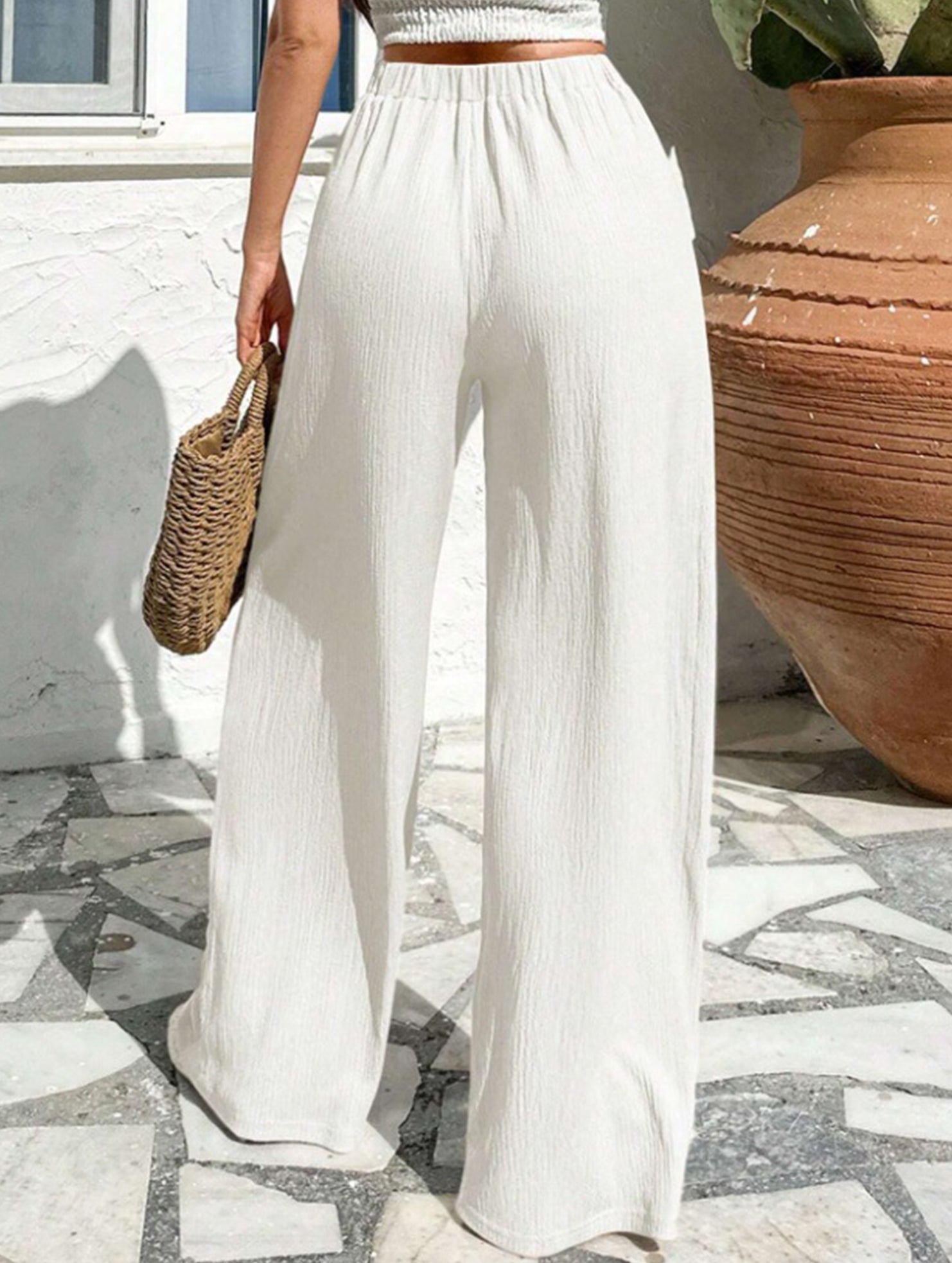 Cross-pleated high-waisted loose-fitting trousers
