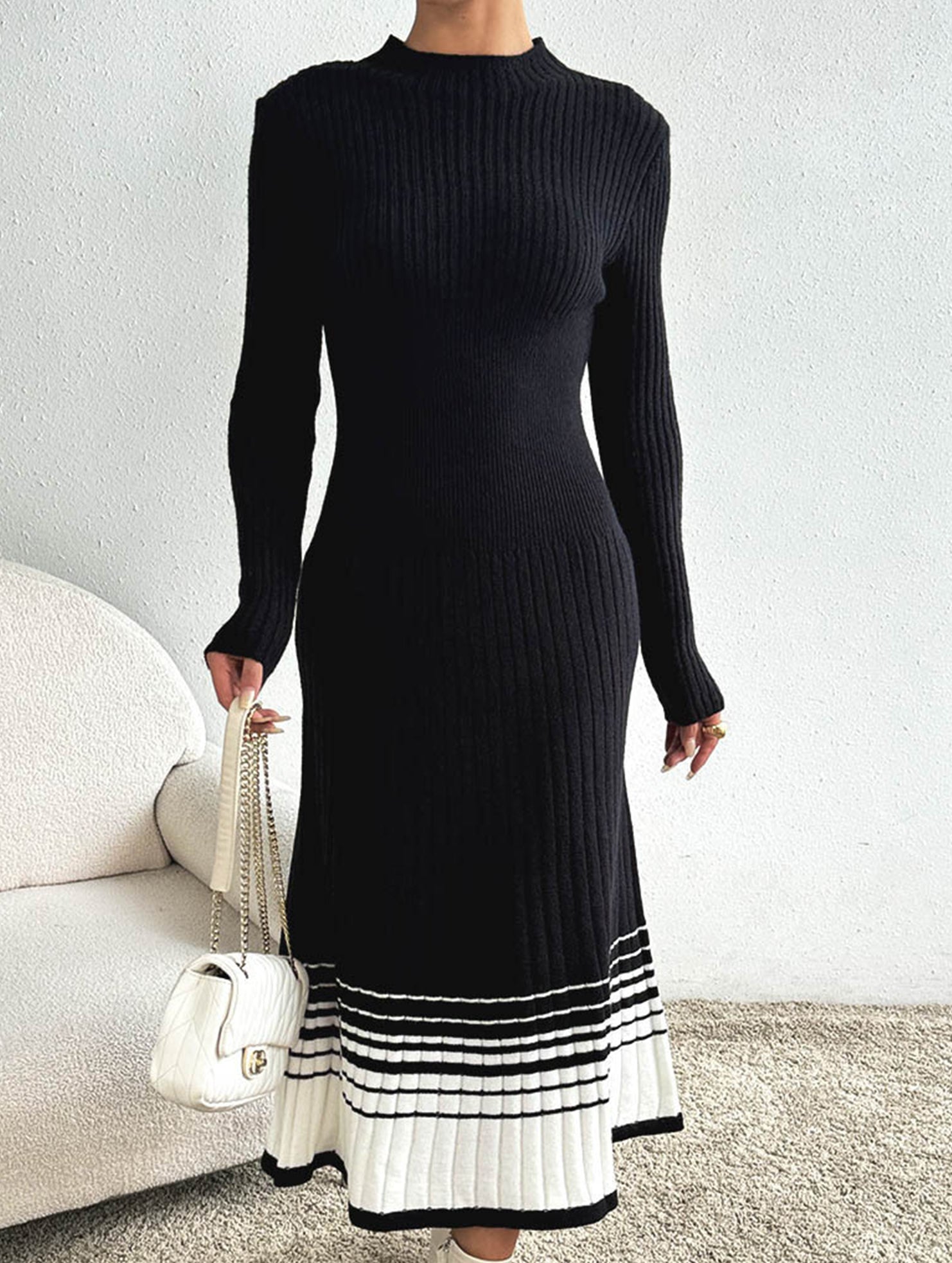 Pleated black and white striped sweater dress