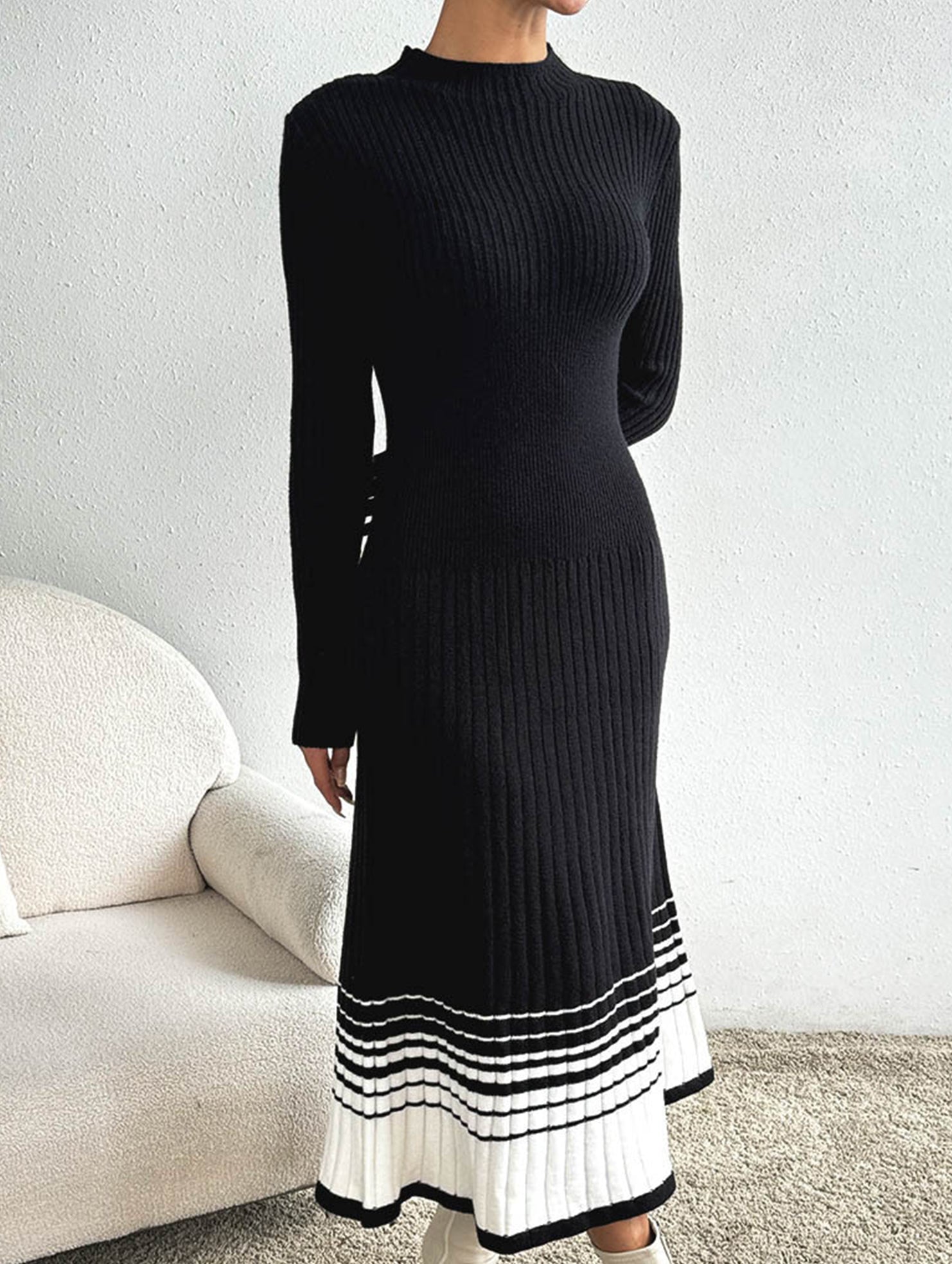 Pleated black and white striped sweater dress